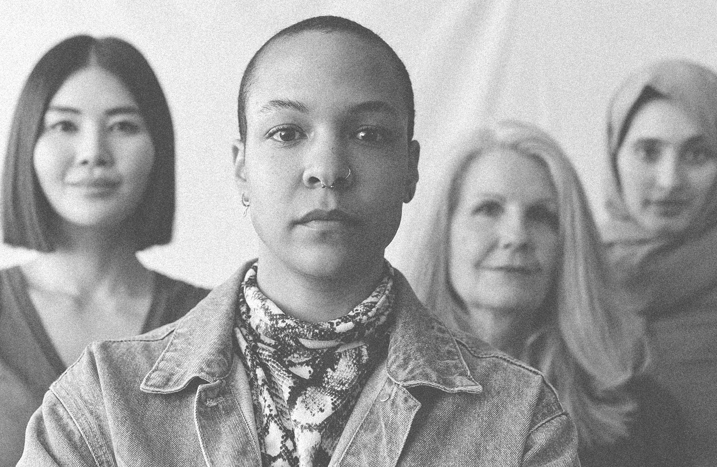 Group of 4 women from diverse backgrounds and ethnicities.