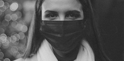 Woman wearing mask.