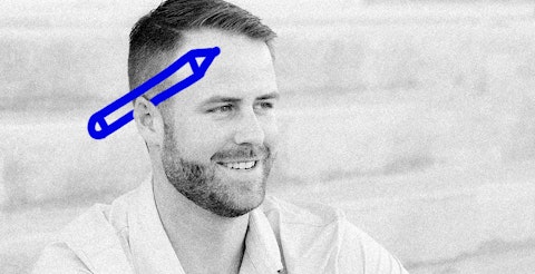 Photo of Lucas Elliott with a fun doodle of a pencil in his ear.